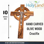 Holy Land Market 10" Celtic Olive Wood Wall Crucifix – Handmade in Bethlehem with Metal Saint Benedict Medal (Front & Back), Certificate, Prayer Card & Medal Explanation – Solid Olive Wood Cross