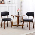 Yilaywain Mid-Century Modern Dining Chairs with Rubberwood Frame, Black Faux Leather Upholstered, 250 LBS Weight Capacity, Anti-Slip Protectors (Black)