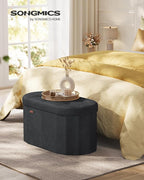 SONGMICS Mazie Collection - Folding Ottoman with Storage, Oval Storage Ottoman Bench, for Living Room, Bedroom, Velvet Fabric, 15 x 30 x 15 Inches, Ink Black ULSF267BH01